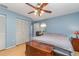 Large main bedroom with wood floors, ceiling fan, and plenty of closet space at 4239 Durant St, Port Charlotte, FL 33948