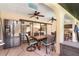Covered patio with dining area, ceiling fans, and view of the kitchen at 4239 Durant St, Port Charlotte, FL 33948