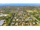 Wide aerial showcasing the neighborhood and coastline at 4564 Iola Dr, Sarasota, FL 34231