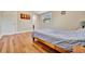 Well lit bedroom with hardwood floors and a gray comforter at 4564 Iola Dr, Sarasota, FL 34231