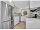 Modern white kitchen with stainless steel appliances at 4564 Iola Dr, Sarasota, FL 34231