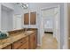 Granite countertop, wooden cabinets, and bedroom view at 500 San Lino Cir # 511, Venice, FL 34292