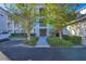 Condo building entrance with lush landscaping and walkway at 500 San Lino Cir # 511, Venice, FL 34292