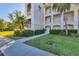 Condo building exterior showcasing landscaping and walkway at 500 San Lino Cir # 511, Venice, FL 34292