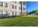 Building exterior showcasing manicured lawn and landscaping at 500 San Lino Cir # 511, Venice, FL 34292