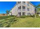 Building exterior with lush landscaping and balconies at 500 San Lino Cir # 511, Venice, FL 34292