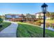 Wooden gazebo and walkway over the lake with lush green landscaping at 500 San Lino Cir # 511, Venice, FL 34292