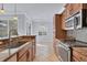 Kitchen with granite countertops, stainless steel appliances, and wood cabinets at 500 San Lino Cir # 511, Venice, FL 34292