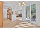 Open kitchen with granite counters, stainless steel appliances, and views to living and dining areas at 500 San Lino Cir # 511, Venice, FL 34292