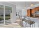 Kitchen features granite countertops, stainless steel appliances, and access to a patio at 500 San Lino Cir # 511, Venice, FL 34292