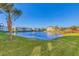 Community lake view with lush green grass and gazebo at 500 San Lino Cir # 511, Venice, FL 34292