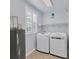 Laundry room with washer, dryer, and overhead shelving at 500 San Lino Cir # 511, Venice, FL 34292