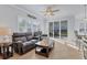 Spacious living room with leather recliners and sliding glass doors at 500 San Lino Cir # 511, Venice, FL 34292