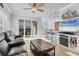 Bright living room, featuring a fireplace and access to a patio at 500 San Lino Cir # 511, Venice, FL 34292
