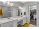 Elegant bathroom with double vanity, large mirror, and walk-in shower at 5397 Bartolomeo St, Sarasota, FL 34238