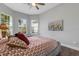 Bedroom with queen bed, window seat, and art at 5397 Bartolomeo St, Sarasota, FL 34238