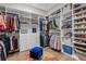 Large walk-in closet with ample shelving and hanging space at 5397 Bartolomeo St, Sarasota, FL 34238