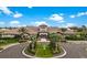 Expansive clubhouse with manicured landscaping, palm trees, and circular driveway at 5397 Bartolomeo St, Sarasota, FL 34238