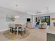 Open dining room with a view of the kitchen and living room at 5397 Bartolomeo St, Sarasota, FL 34238