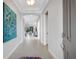 Elegant entryway with tile floors and views into living room and exterior at 5397 Bartolomeo St, Sarasota, FL 34238