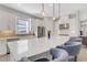 Modern kitchen with white cabinets, stainless steel appliances, and quartz countertops at 5397 Bartolomeo St, Sarasota, FL 34238