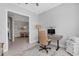Bright home office with desk, chair, and ample natural light at 5397 Bartolomeo St, Sarasota, FL 34238