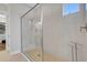 Spacious walk-in shower with glass enclosure and neutral tile at 5397 Bartolomeo St, Sarasota, FL 34238