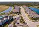 Aerial view of community with lakefront homes and landscaping at 6226 Plateau Ct, Bradenton, FL 34203