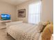 Comfortable bedroom with queen bed and TV at 6226 Plateau Ct, Bradenton, FL 34203