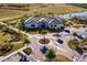 Aerial view of community clubhouse with circular driveway and landscaping at 6226 Plateau Ct, Bradenton, FL 34203