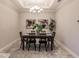 Elegant dining room with dark wood table and chandelier at 6226 Plateau Ct, Bradenton, FL 34203