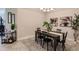 Elegant dining room with dark wood table and chandelier at 6226 Plateau Ct, Bradenton, FL 34203