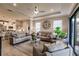 Open living space with comfy seating and views into kitchen area at 6226 Plateau Ct, Bradenton, FL 34203