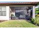 Screened porch with seating area and view of yard at 6226 Plateau Ct, Bradenton, FL 34203