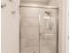Large walk-in shower with glass enclosure and tiled walls at 6226 Plateau Ct, Bradenton, FL 34203