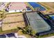 Aerial view of a tennis court within a residential community at 6226 Plateau Ct, Bradenton, FL 34203