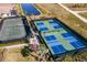 Aerial view of tennis and pickleball courts with surrounding landscaping at 6226 Plateau Ct, Bradenton, FL 34203
