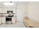 Bright kitchen with white cabinetry and stainless steel appliances at 6640 Pineview Ter, Bradenton, FL 34203