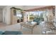 Living room with golf course view through sliding doors at 6640 Pineview Ter # 6640, Bradenton, FL 34203