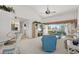 Open living area with dining table, seating area, and golf course views at 6640 Pineview Ter # 6640, Bradenton, FL 34203