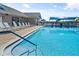 Community pool with lounge chairs and shade structures at 6640 Pineview Ter, Bradenton, FL 34203