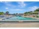 Community pool with plenty of space for sunbathing at 676 Park Cir, Bradenton, FL 34207