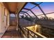Evening view from a private balcony overlooking a backyard oasis at 7041 Beechmont Ter, Lakewood Ranch, FL 34202