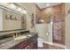 Bathroom features granite countertop and walk-in shower at 7041 Beechmont Ter, Lakewood Ranch, FL 34202