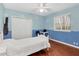 Bright bedroom with double doors and hardwood floors at 7041 Beechmont Ter, Lakewood Ranch, FL 34202