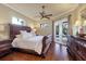 Elegant main bedroom with hardwood floors and ensuite bath at 7041 Beechmont Ter, Lakewood Ranch, FL 34202