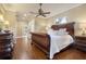 Bright bedroom with hardwood floors and ensuite bath access at 7041 Beechmont Ter, Lakewood Ranch, FL 34202