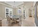 Spacious dining area with elegant furnishings and natural light at 7041 Beechmont Ter, Lakewood Ranch, FL 34202
