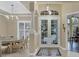 Bright dining room with a table for six and access to the foyer at 7041 Beechmont Ter, Lakewood Ranch, FL 34202