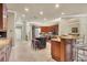 Modern kitchen with granite countertops, ample cabinetry, and an island at 7041 Beechmont Ter, Lakewood Ranch, FL 34202